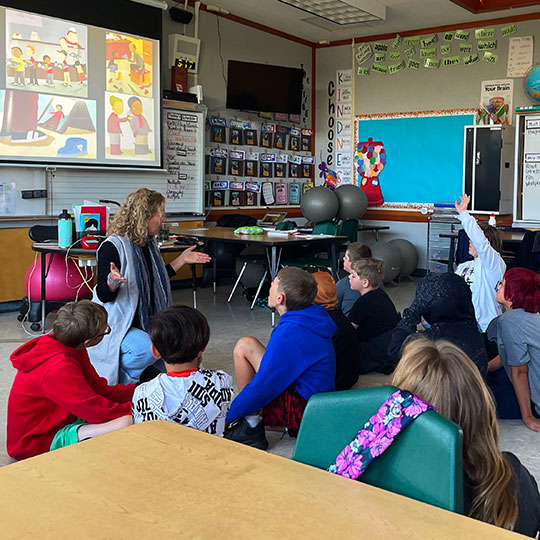 A classroom of students doing art