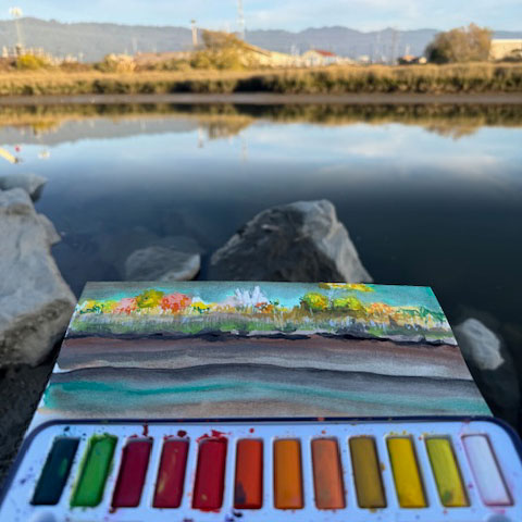 Painting a watercolor outdoors